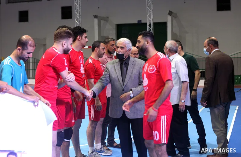 Palestinians attend the opening of Saad Sayel Hall after its renovation to host the first volleyball match, in Gaza City on June 13, 2021. Saad Sayel Hall hosted the first volleyball match after its renovation between Kh...