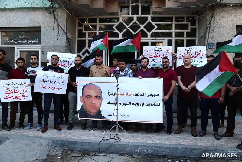 Demonstrators take part in a protest following the death of Nizar Banat, a Palestinian parliamentary candidate who criticised the Palestinian Authority and died after being arrested by PA security forces, in Gaza city Ju...
