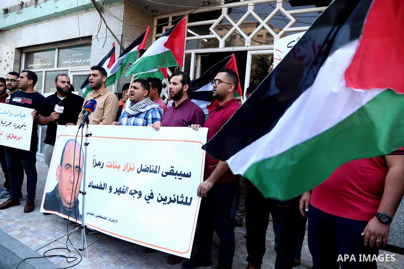 Demonstrators take part in a protest following the death of Nizar Banat, a Palestinian parliamentary candidate who criticised the Palestinian Authority and died after being arrested by PA security forces, in Gaza city Ju...