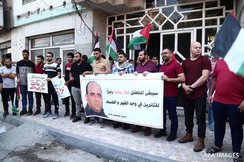 Demonstrators take part in a protest following the death of Nizar Banat, a Palestinian parliamentary candidate who criticised the Palestinian Authority and died after being arrested by PA security forces, in Gaza city Ju...