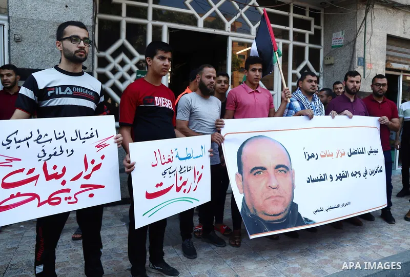 Demonstrators take part in a protest following the death of Nizar Banat, a Palestinian parliamentary candidate who criticised the Palestinian Authority and died after being arrested by PA security forces, in Gaza city Ju...