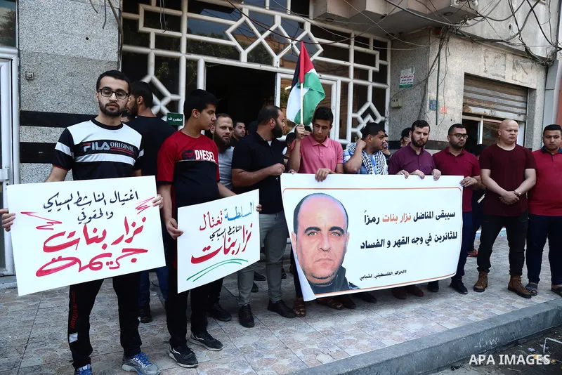 Demonstrators take part in a protest following the death of Nizar Banat, a Palestinian parliamentary candidate who criticised the Palestinian Authority and died after being arrested by PA security forces, in Gaza city Ju...