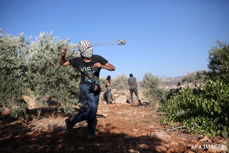 Palestinian protesters take part in a demonstration against the newly built Israeli settlers' outpost of Eviatar in the town of Beita, near the occupied West Bank city of Nablus, on June 24, 2021. Photo by Shadi Jarar'ah
