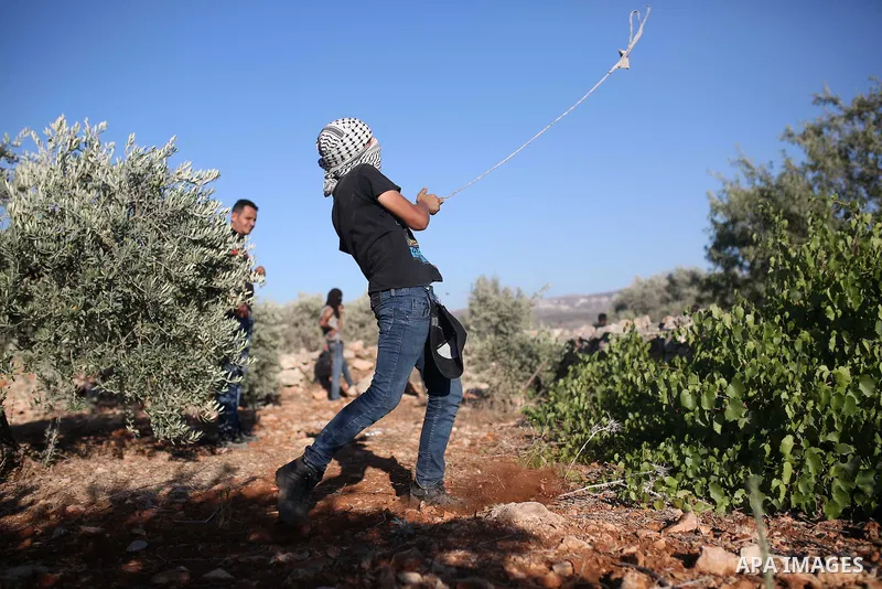 Palestinian protesters take part in a demonstration against the newly built Israeli settlers' outpost of Eviatar in the town of Beita, near the occupied West Bank city of Nablus, on June 24, 2021. Photo by Shadi Jarar'ah