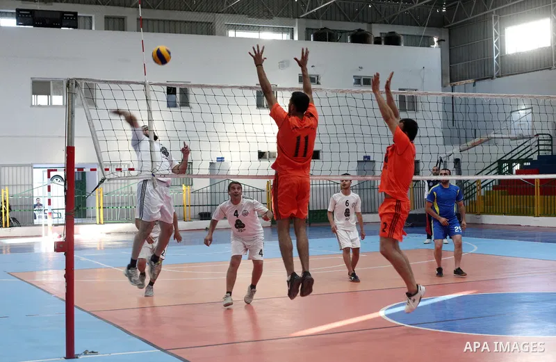 Palestinian players of Moghraqa team and players of el-Ribat team in actions during Volleyball match in Gaza city on June 24, 2021. Photo by Ali Hamad