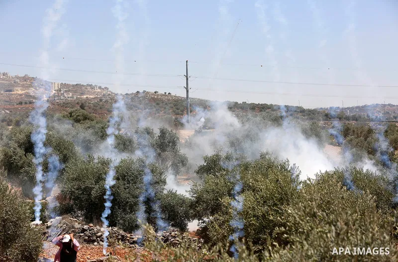 Palestinian demonstrators clash with Israeli security forces after a protest against the newly built Israeli settlers' outpost of Eviatar in the town of Beita, near Nablus in the north of the occupied West Bank, on June...
