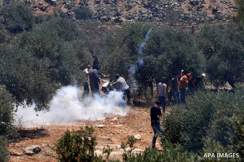 Palestinian demonstrators clash with Israeli security forces after a protest against the newly built Israeli settlers' outpost of Eviatar in the town of Beita, near Nablus in the north of the occupied West Bank, on June...