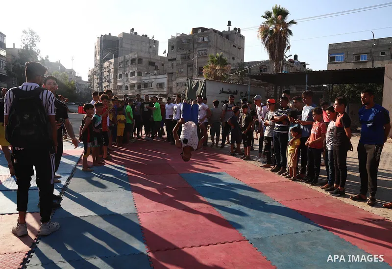Palestinian youths show off their skills in parkour, gymnastics and breakdance, in Gaza city on June 25, 2021. Breakdance, the hip hop dance style that began on the streets of New York City more than 30 years ago has bec...