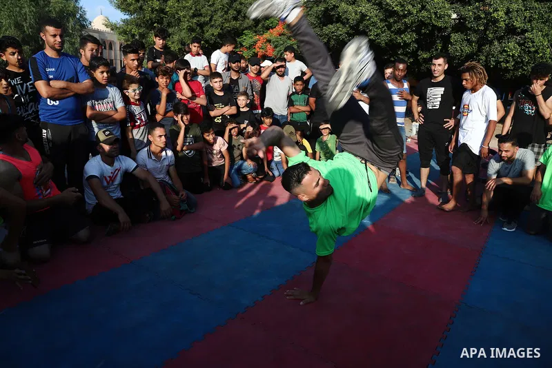 Palestinian youths show off their skills in parkour, gymnastics and breakdance, in Gaza city on June 25, 2021. Breakdance, the hip hop dance style that began on the streets of New York City more than 30 years ago has bec...