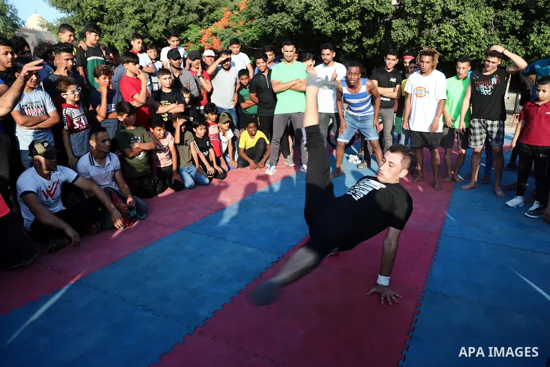 Palestinian youths show off their skills in parkour, gymnastics and breakdance, in Gaza city on June 25, 2021. Breakdance, the hip hop dance style that began on the streets of New York City more than 30 years ago has bec...