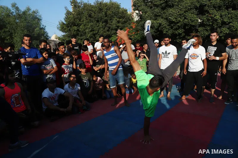 Palestinian youths show off their skills in parkour, gymnastics and breakdance, in Gaza city on June 25, 2021. Breakdance, the hip hop dance style that began on the streets of New York City more than 30 years ago has bec...