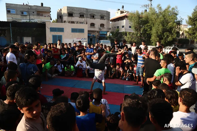 Palestinian youths show off their skills in parkour, gymnastics and breakdance, in Gaza city on June 25, 2021. Breakdance, the hip hop dance style that began on the streets of New York City more than 30 years ago has bec...