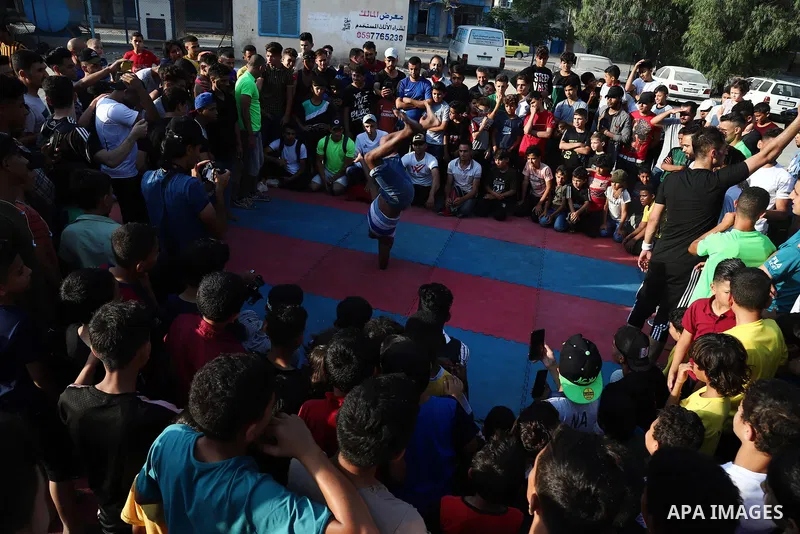 Palestinian youths show off their skills in parkour, gymnastics and breakdance, in Gaza city on June 25, 2021. Breakdance, the hip hop dance style that began on the streets of New York City more than 30 years ago has bec...