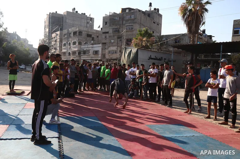 Palestinian youths show off their skills in parkour, gymnastics and breakdance, in Gaza city on June 25, 2021. Breakdance, the hip hop dance style that began on the streets of New York City more than 30 years ago has bec...