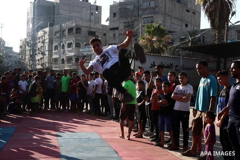 Palestinian youths show off their skills in parkour, gymnastics and breakdance, in Gaza city on June 25, 2021. Breakdance, the hip hop dance style that began on the streets of New York City more than 30 years ago has bec...