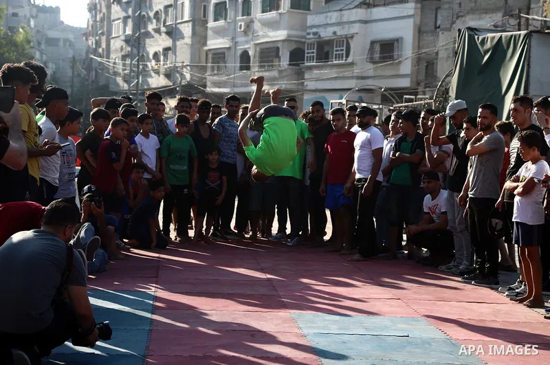 Palestinian youths show off their skills in parkour, gymnastics and breakdance, in Gaza city on June 25, 2021. Breakdance, the hip hop dance style that began on the streets of New York City more than 30 years ago has bec...