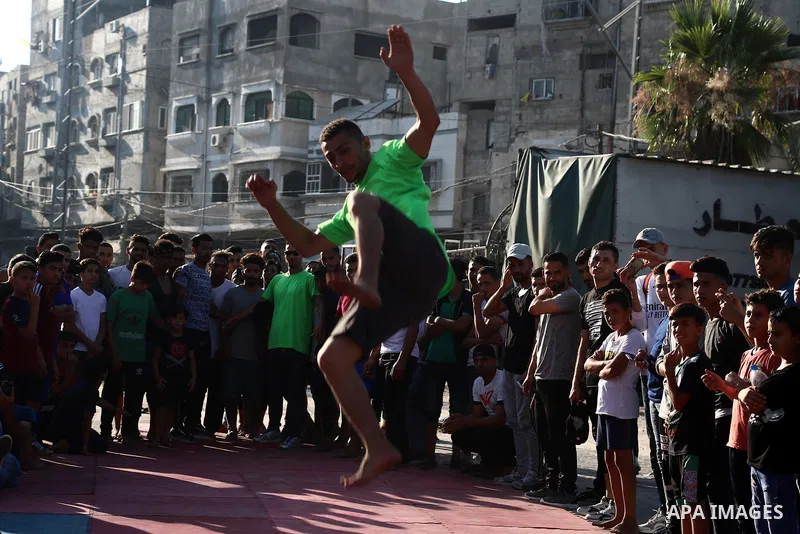 Palestinian youths show off their skills in parkour, gymnastics and breakdance, in Gaza city on June 25, 2021. Breakdance, the hip hop dance style that began on the streets of New York City more than 30 years ago has bec...