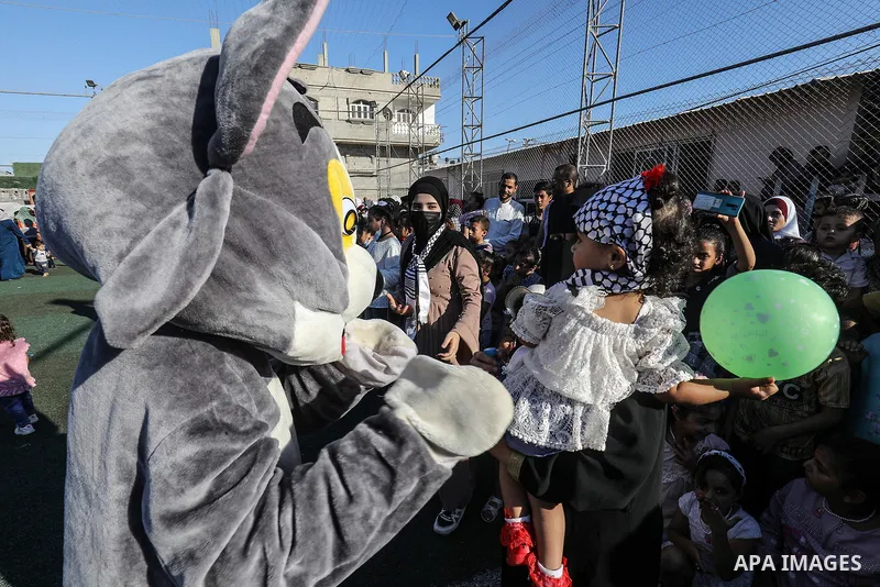 Palestinian children participate in a mental health support session during entertainment festival after the latest Israeli escalation, in Rafah in the southern Gaza Strip, on June 25, 2021. Photo by Abed Deeb