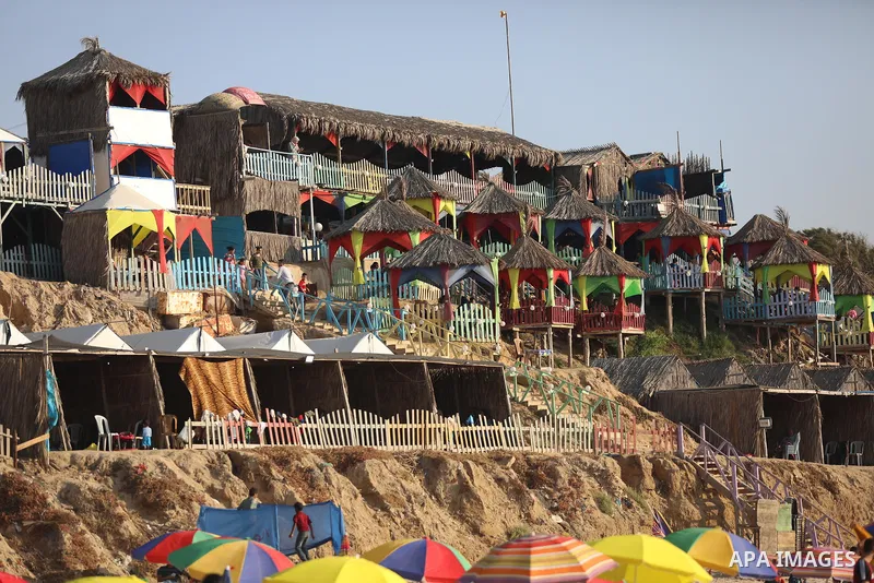 Palestinians enjoy their time on huts overlooking the beach of the Mediterranean sea in Deir al-Balah in the center of Gaza Strip, on June 25, 2021. The beach is one of the few open public spaces in this densely populate...