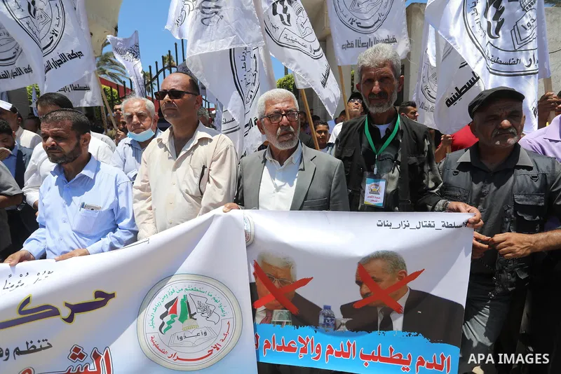 Palestinian supporters of Al-Ahrar movement take part in a protest following the death of Nizar Banat, a Palestinian parliamentary candidate who criticised the Palestinian Authority and died after being arrested by PA se...
