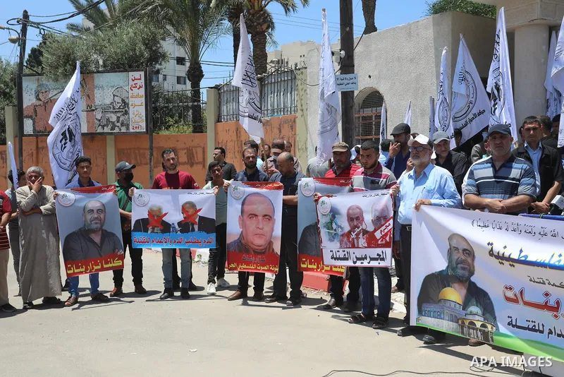Palestinian supporters of Al-Ahrar movement take part in a protest following the death of Nizar Banat, a Palestinian parliamentary candidate who criticised the Palestinian Authority and died after being arrested by PA se...