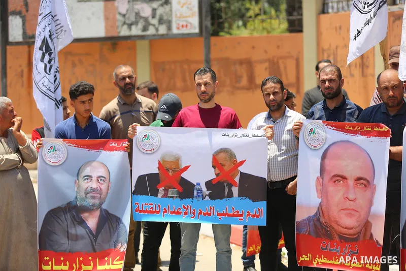Palestinian supporters of Al-Ahrar movement take part in a protest following the death of Nizar Banat, a Palestinian parliamentary candidate who criticised the Palestinian Authority and died after being arrested by PA se...