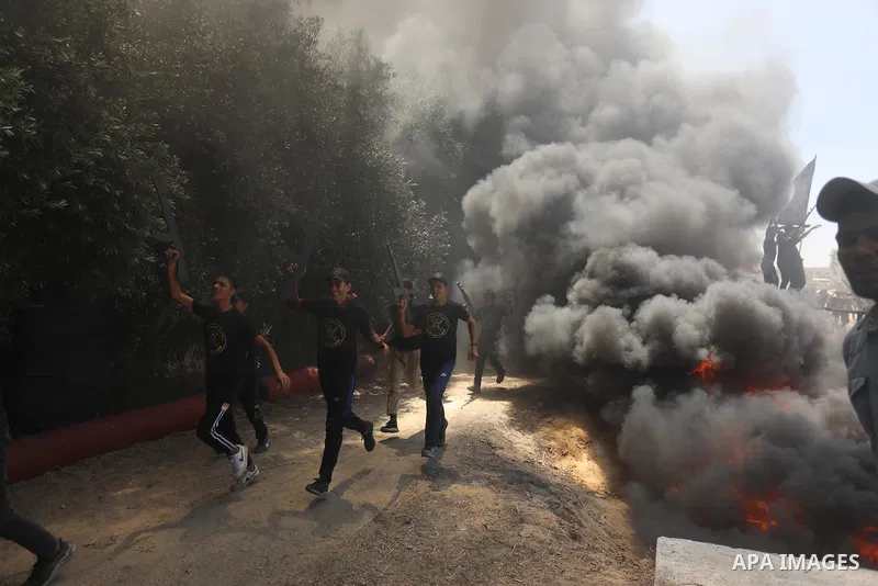 Young Palestinians attend a military summer camp organised by the Islamic Jihad Movement, in Gaza City, June 26, 2021. Photo by Ashraf Amra