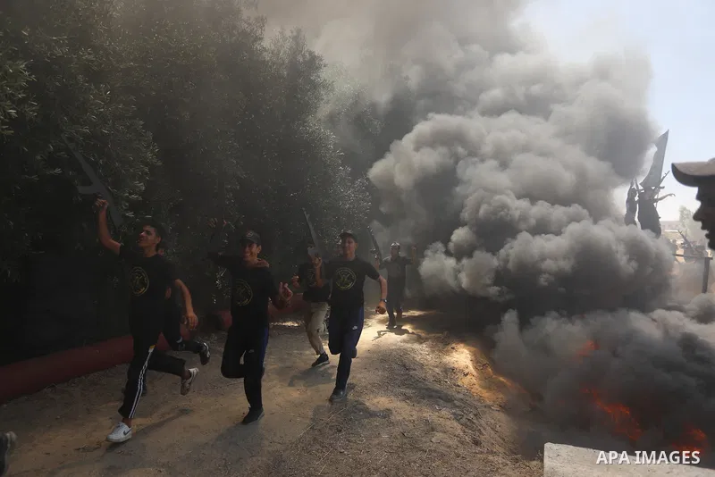 Young Palestinians attend a military summer camp organised by the Islamic Jihad Movement, in Gaza City, June 26, 2021. Photo by Ashraf Amra