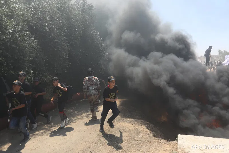 Young Palestinians attend a military summer camp organised by the Islamic Jihad Movement, in Gaza City, June 26, 2021. Photo by Ashraf Amra