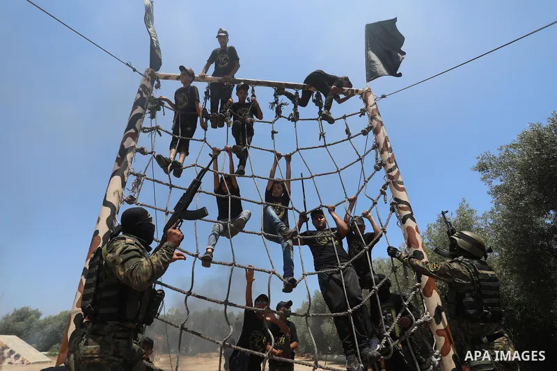 Young Palestinians attend a military summer camp organised by the Islamic Jihad Movement, in Gaza City, June 26, 2021. Photo by Ashraf Amra
