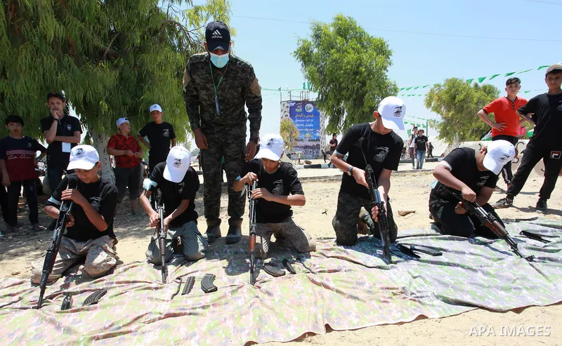 Young Palestinians take part in a military-style exercise a Hamas-run summer camp at the Yarmouk military site, in Gaza city, on July 26, 2021. Photo by Naaman Omar