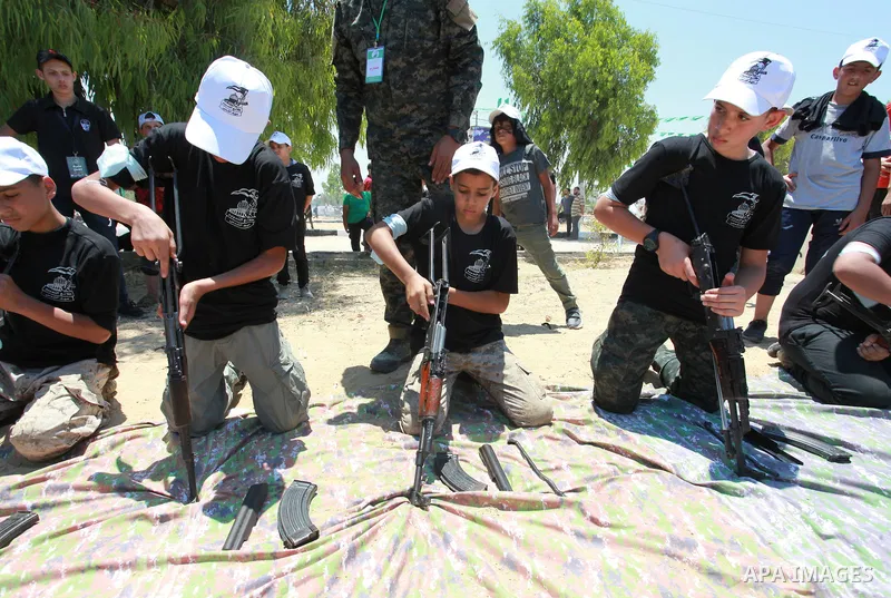 Young Palestinians take part in a military-style exercise a Hamas-run summer camp at the Yarmouk military site, in Gaza city, on July 26, 2021. Photo by Naaman Omar