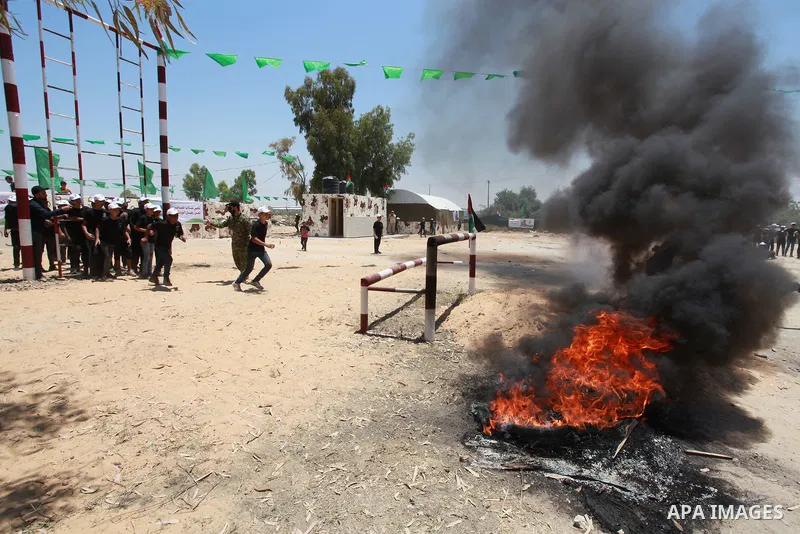 Young Palestinians take part in a military-style exercise a Hamas-run summer camp at the Yarmouk military site, in Gaza city, on July 26, 2021. Photo by Naaman Omar