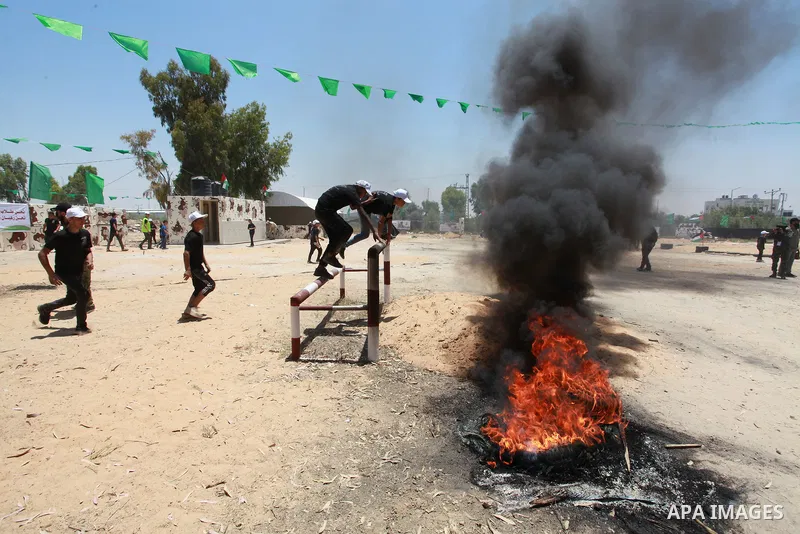 Young Palestinians take part in a military-style exercise a Hamas-run summer camp at the Yarmouk military site, in Gaza city, on July 26, 2021. Photo by Naaman Omar
