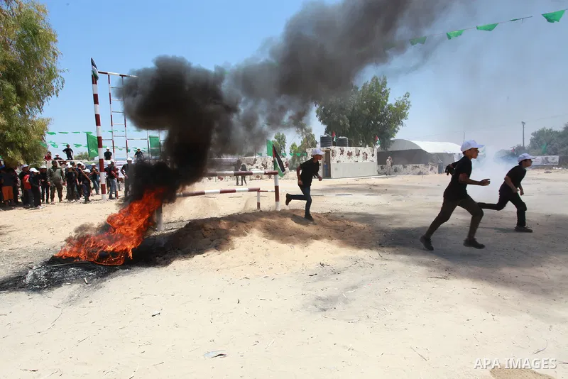 Young Palestinians take part in a military-style exercise a Hamas-run summer camp at the Yarmouk military site, in Gaza city, on July 26, 2021. Photo by Naaman Omar