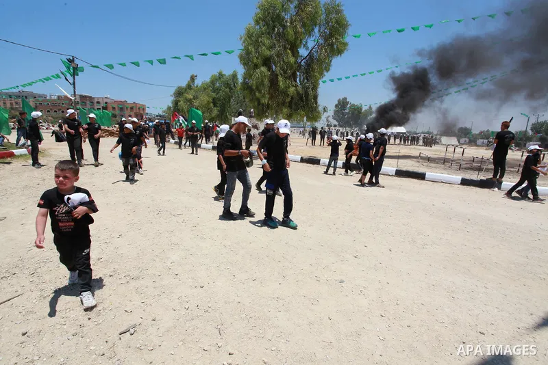 Young Palestinians take part in a military-style exercise a Hamas-run summer camp at the Yarmouk military site, in Gaza city, on July 26, 2021. Photo by Naaman Omar