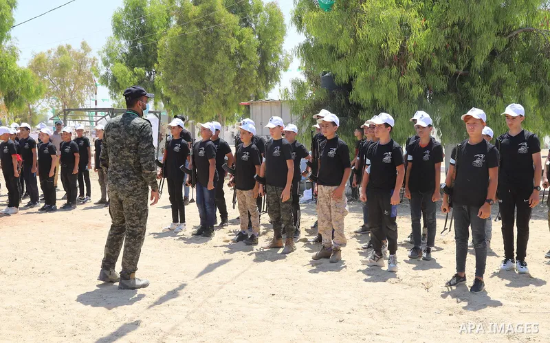 Young Palestinians take part in a military-style exercise a Hamas-run summer camp at the Yarmouk military site, in Gaza city, on July 26, 2021. Photo by Naaman Omar