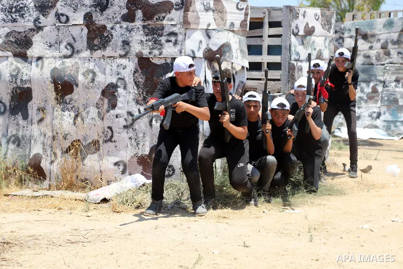 Young Palestinians take part in a military-style exercise a Hamas-run summer camp at the Yarmouk military site, in Gaza city, on July 26, 2021. Photo by Naaman Omar
