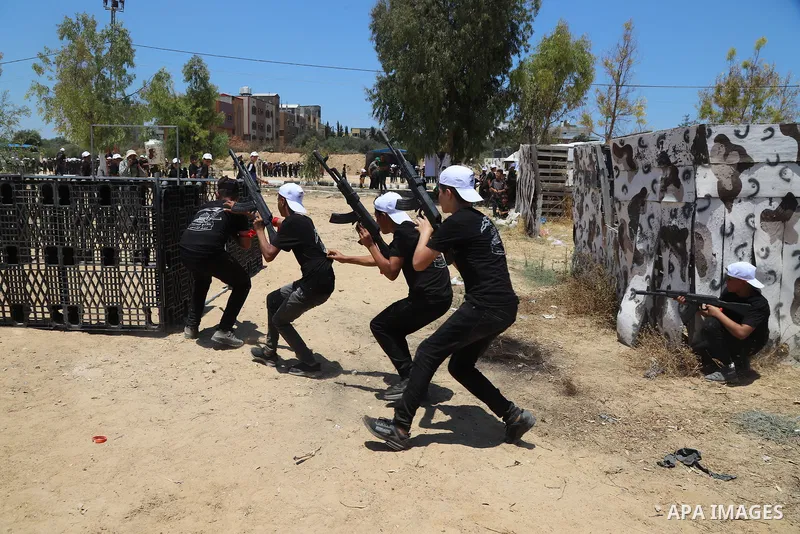 Young Palestinians take part in a military-style exercise a Hamas-run summer camp at the Yarmouk military site, in Gaza city, on July 26, 2021. Photo by Naaman Omar