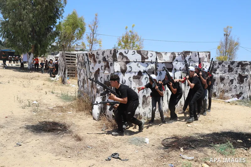 Young Palestinians take part in a military-style exercise a Hamas-run summer camp at the Yarmouk military site, in Gaza city, on July 26, 2021. Photo by Naaman Omar