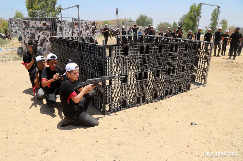 Young Palestinians take part in a military-style exercise a Hamas-run summer camp at the Yarmouk military site, in Gaza city, on July 26, 2021. Photo by Naaman Omar