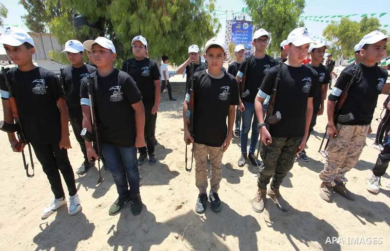 Young Palestinians take part in a military-style exercise a Hamas-run summer camp at the Yarmouk military site, in Gaza city, on July 26, 2021. Photo by Naaman Omar