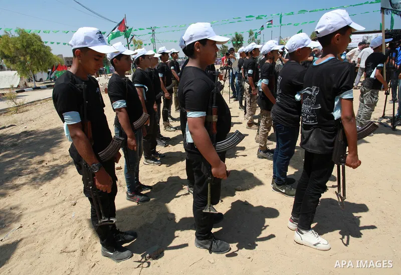 Young Palestinians take part in a military-style exercise a Hamas-run summer camp at the Yarmouk military site, in Gaza city, on July 26, 2021. Photo by Naaman Omar