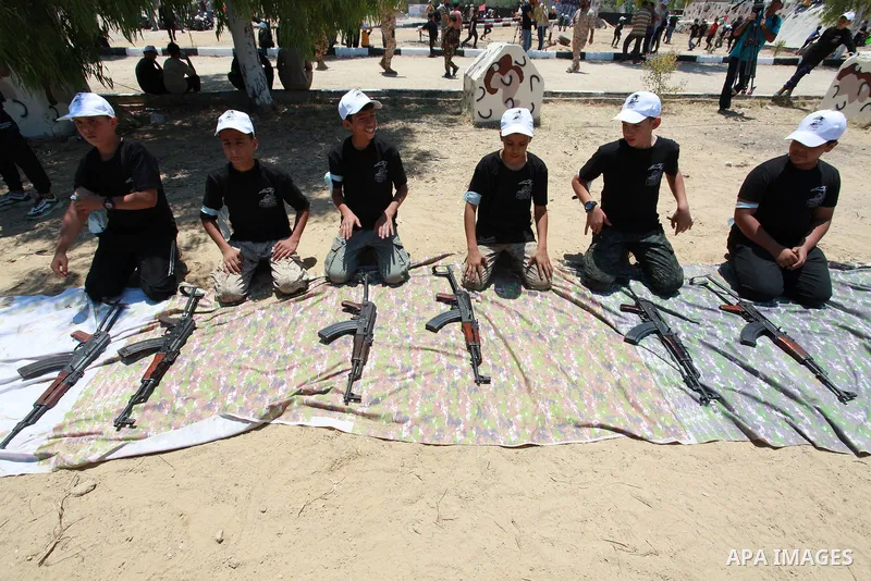 Young Palestinians take part in a military-style exercise a Hamas-run summer camp at the Yarmouk military site, in Gaza city, on July 26, 2021. Photo by Naaman Omar