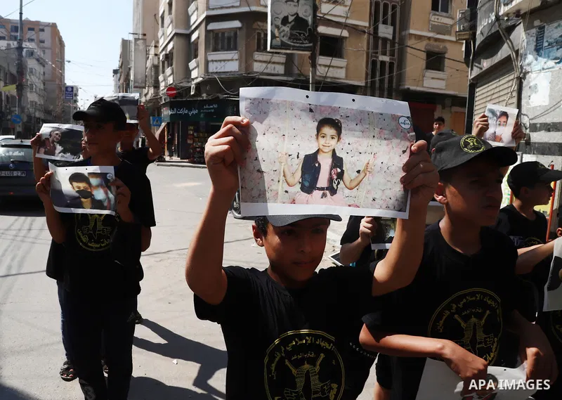 Palestinian youths attend a press conference to announc the summer camps organised by the Islamic Jihad Movement, in Gaza city, on July 26, 2021. Photo by Naaman Omar