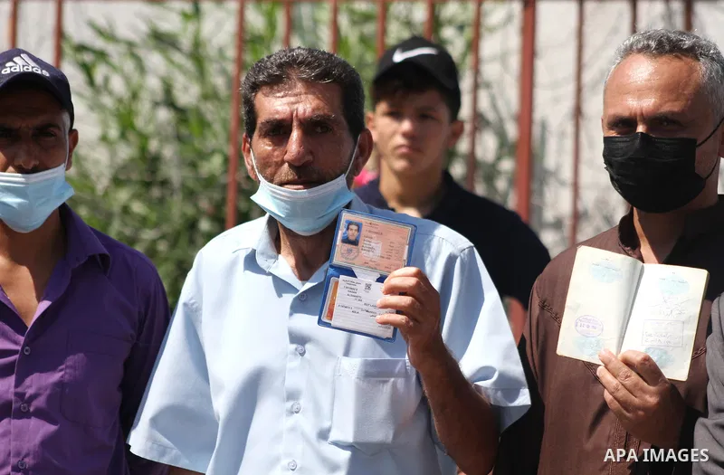 Palestinians hold IDs and banners to demand of the family unification, in front of the headquarter United Nation "UNSCO" in Gaza city, on June 27 2021. Israeli laws and policies prevent the reunification of families betw...