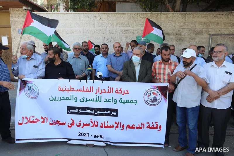 Palestinians take part in a protest to show solidarity with prisoners on hunger strike in Israeli Jails, in front of the headquarters of Red cross in Gaza city on June 27 2021. Palestinian administrative detainees in Isr...