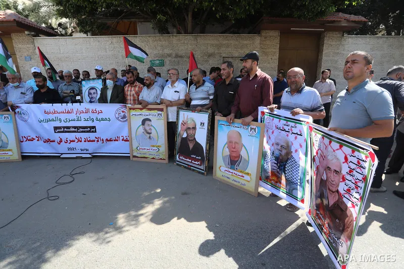 Palestinians take part in a protest to show solidarity with prisoners on hunger strike in Israeli Jails, in front of the headquarters of Red cross in Gaza city on June 27 2021. Palestinian administrative detainees in Isr...