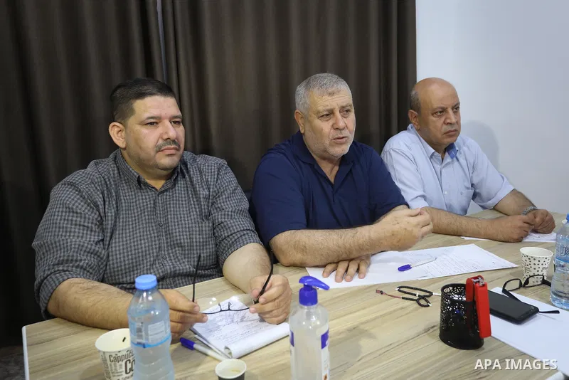 Palestinian members of the National and Islamic forces attend a meeting, in Gaza city, on June 28, 2020. Palestinian group Hamas said Saturday it will not accept any delay in the reconstruction of the Gaza Strip or lifti...