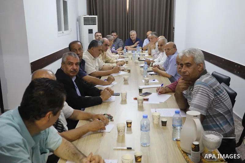 Palestinian members of the National and Islamic forces attend a meeting, in Gaza city, on June 28, 2020. Palestinian group Hamas said Saturday it will not accept any delay in the reconstruction of the Gaza Strip or lifti...